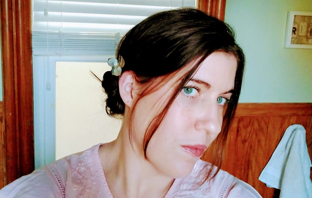 woman taking selfie in bathroom