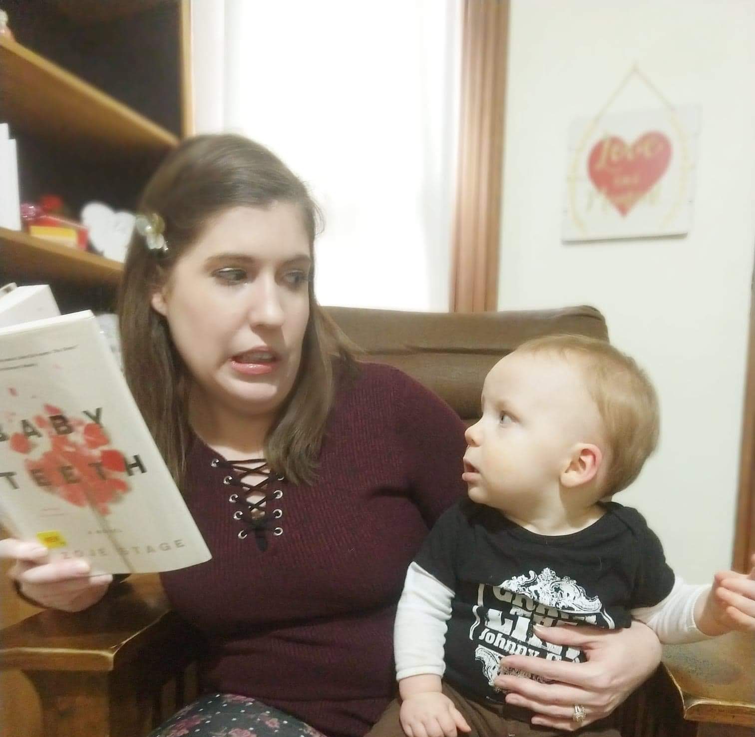 woman and baby looking suspiciously at each other